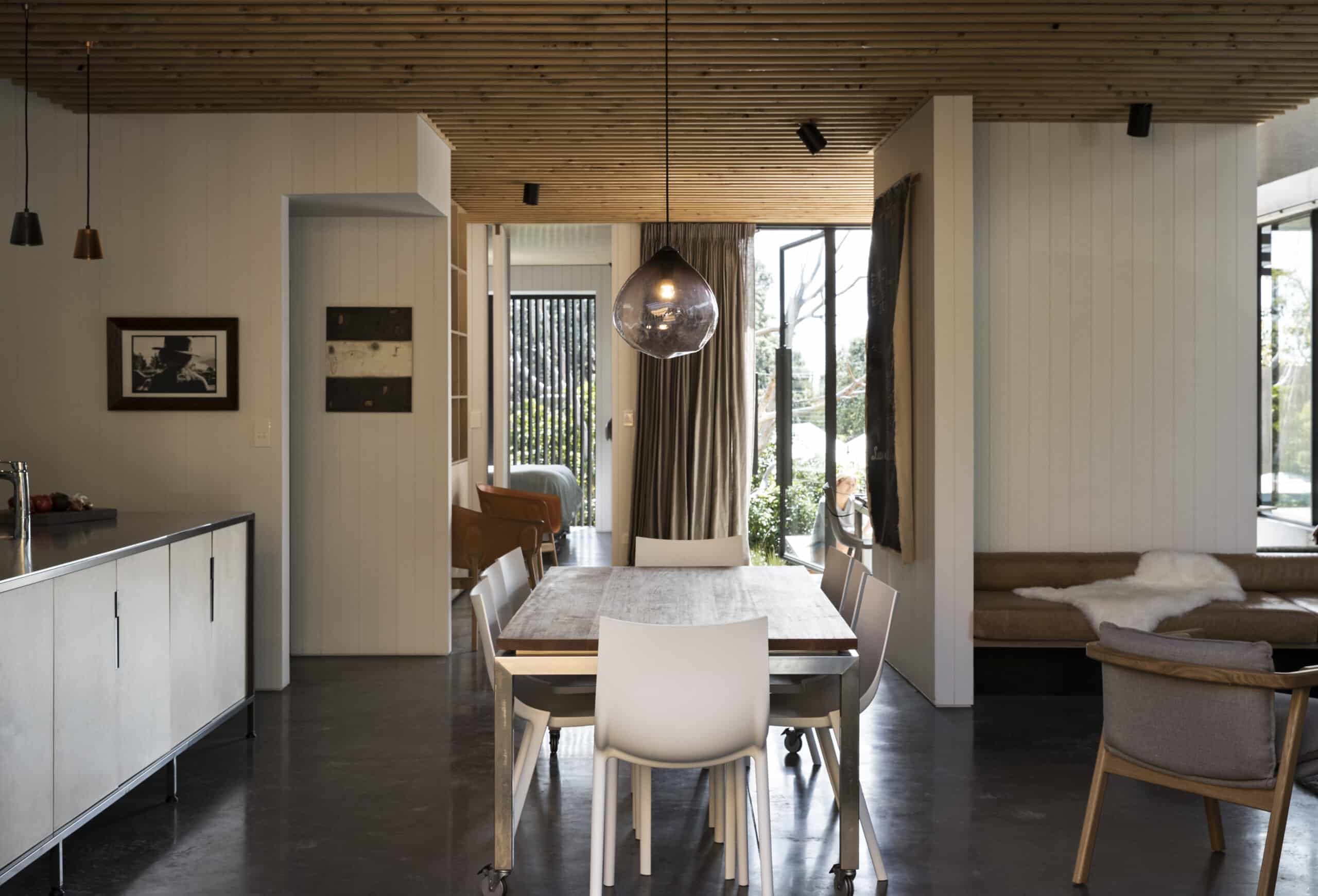 coloured concrete floor in kitchen and dining room.