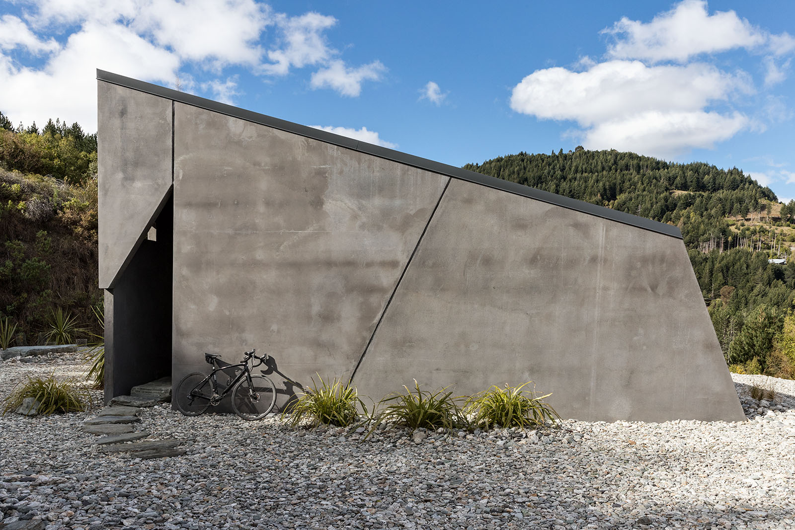 bike leaning against coloured concrete wall