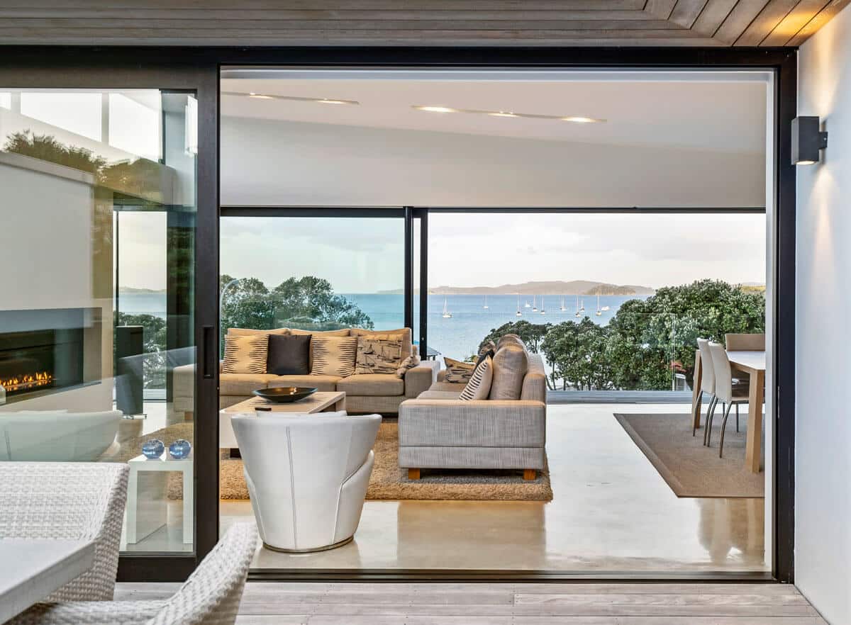 coloured concrete floor in Auckland home overlooking Rangitoto Island.