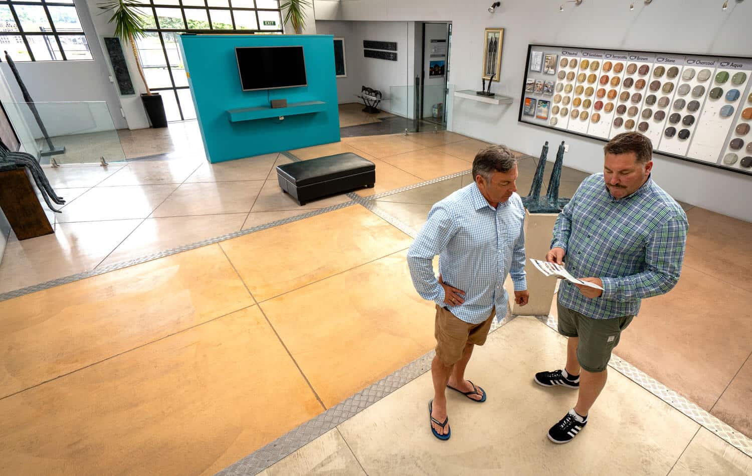 PeterFell-Coloured-Concrete-Floor-Showroom Paul and Stu discussing coloured concrete in the PeterFell Showroom.
