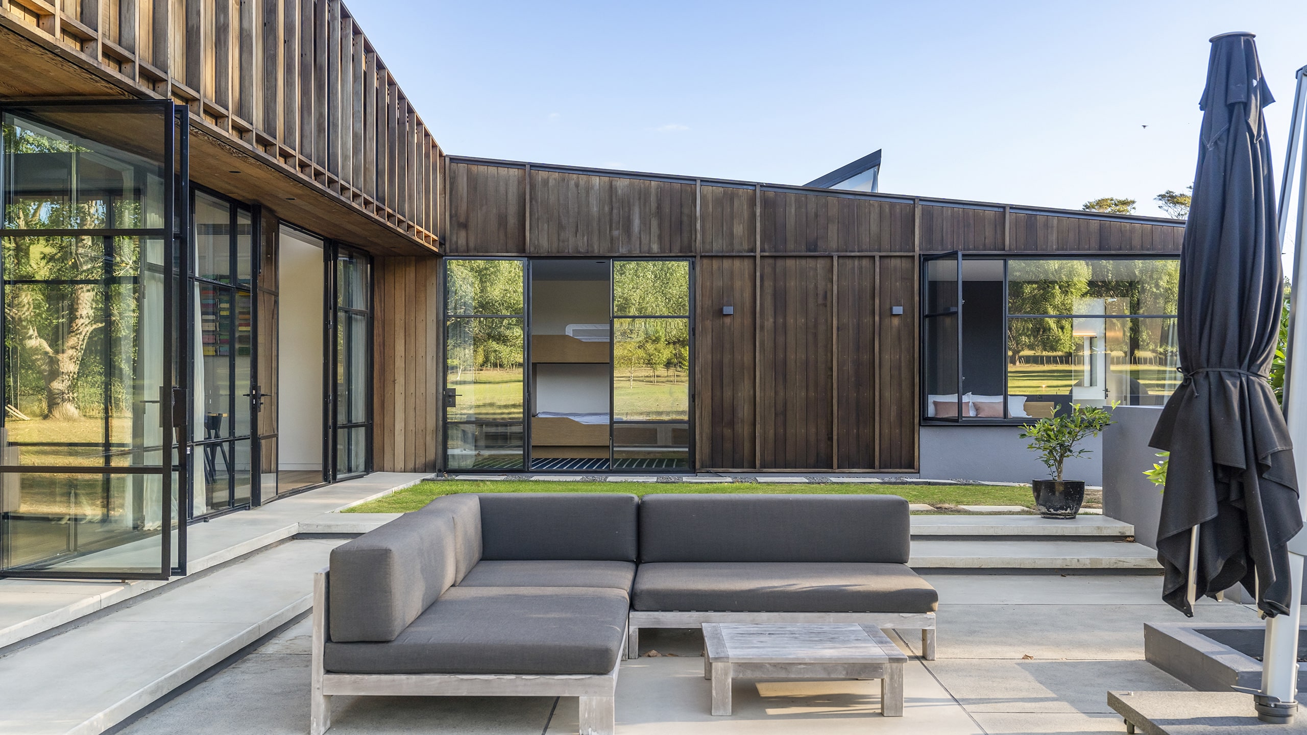 Coloured concrete outdoor courtyard entertaining area.