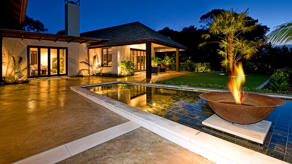 coloured-concrete-patio-courtyard-with-borders Coloured concrete patio and water feature