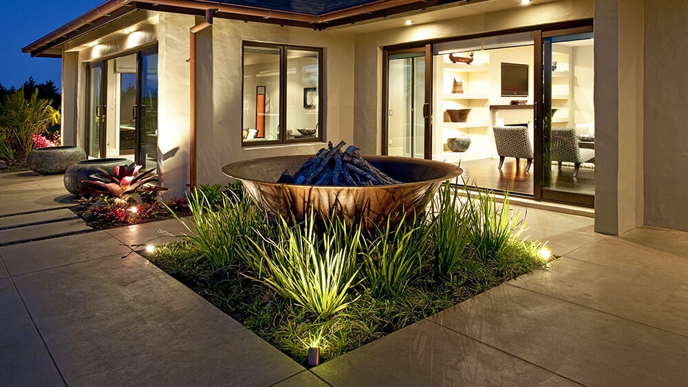 coloured-concrete-patio-courtyard-with-cut-outs-2 Coloured concrete courtyard at night