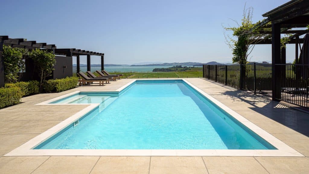 inground pool with concrete surround